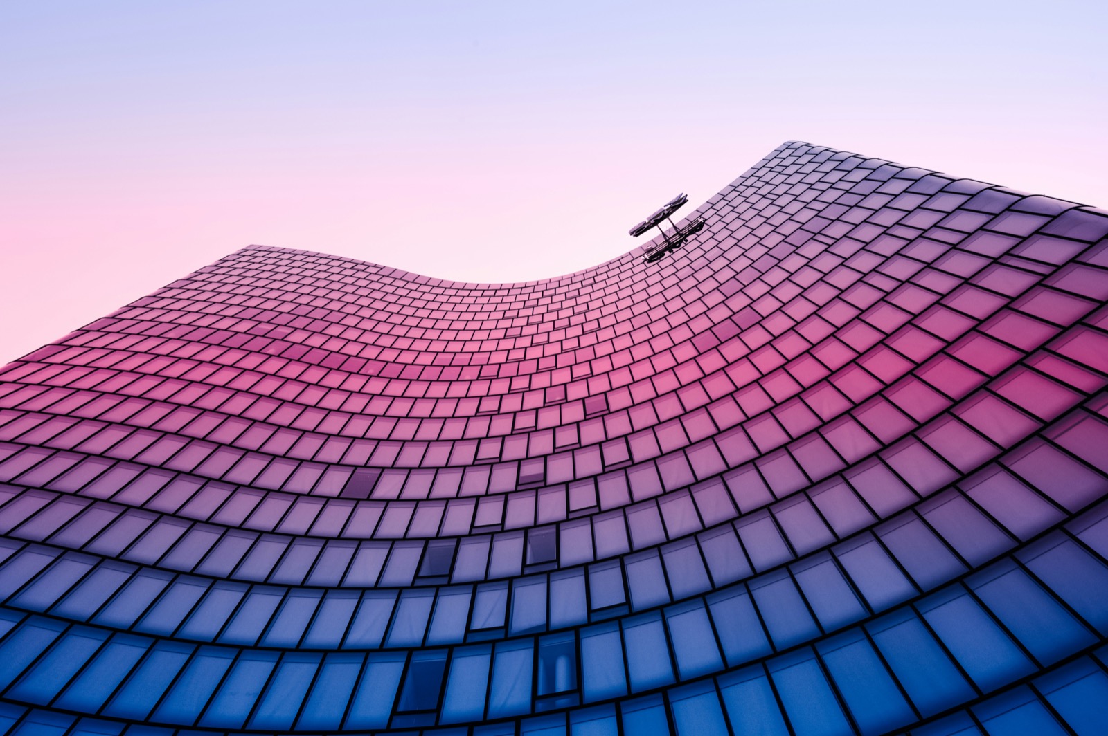 A sweeping architectural facade at dusk